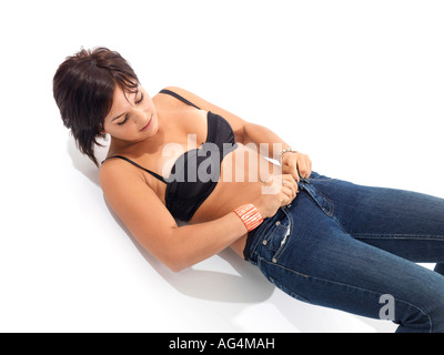 Frau, Modell veröffentlicht Jeans anziehen Stockfoto