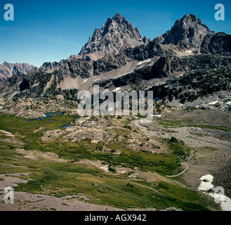 Pferd Pack String überquert einen hohen Pass auf der Westseite des Grand Teton Mountains an der Grenze von Wyoming und Idaho Stockfoto