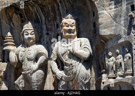 Geschnitzten Buddha-Statuen in Longmen Grotten, Dragon Gate Grotten zum Yi er Fluss, Henan Provinz, China Stockfoto