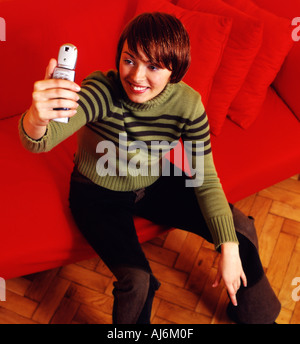 Junge Frau Foto zu tun. Stockfoto