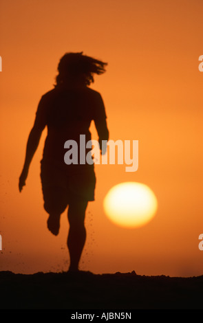 Silhouette Läufer gegen Sonnenuntergang Stockfoto