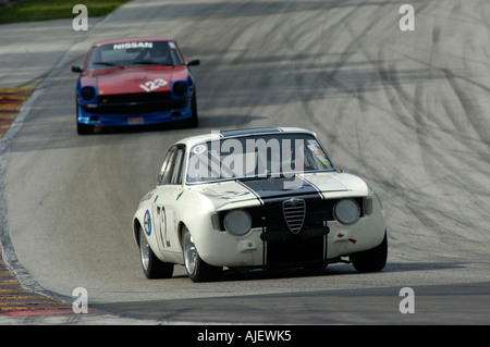 Eine 1967 folgte ein 1972 Datsun 240Z in 2006 Kohler International Challenge mit Brian Redman Alfa Romeo GTV Stockfoto