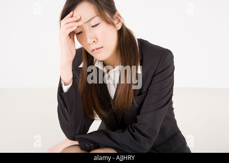 Gestresste junge Frau Stockfoto