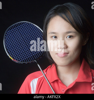 Porträt einer jungen Frau mit einem Badminton-Schläger Stockfoto