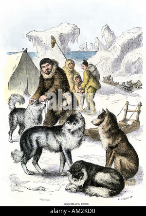 Inuit Familie mit Hund team und Schlitten 1800. Hand - farbige Holzschnitt Stockfoto