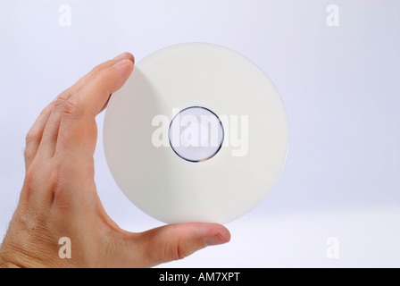 Hand hält eine CD Stockfoto