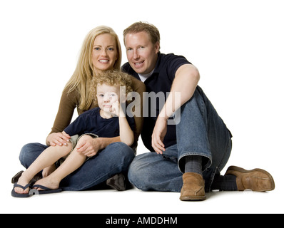 Paar mit Kind Schneidersitz sitzen Stockfoto