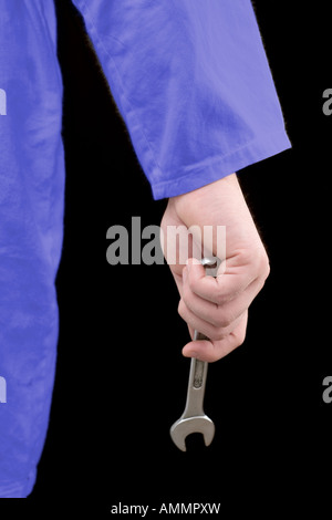 Hand mit einem Schraubenschlüssel Stockfoto