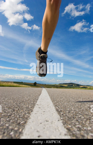 Jogger laufen auf Straße Stockfoto