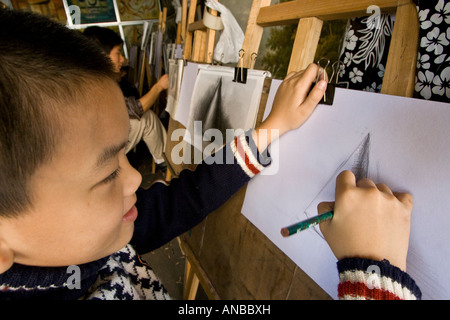 Chinesische junge skizzieren Da Fen Malerei Dorf Shenzhen China Stockfoto