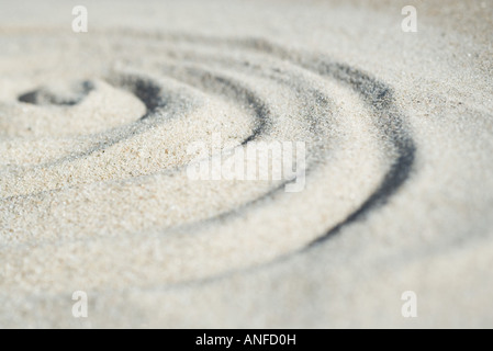 Spiralform in Sand, Nahaufnahme, Oberfläche Ebene gezeichnet Stockfoto