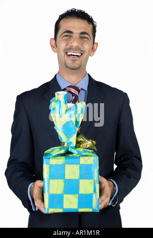 Geschäftsmann hält vorhanden Stockfoto