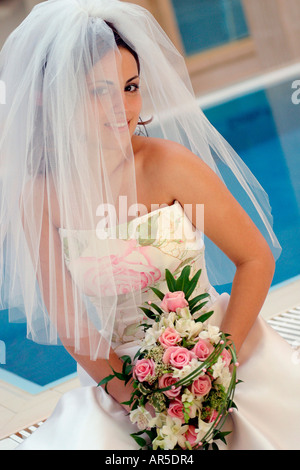 Ein Porträt einer schönen Braut an ihrem Hochzeitstag Stockfoto