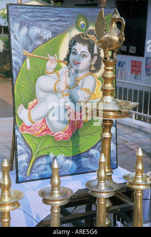 ein Wandbild von jungen lord Krishna mit einer Querflöte. Indien, Kerala, ein Staat an der tropischen Küste von Süd-west Indien Stockfoto