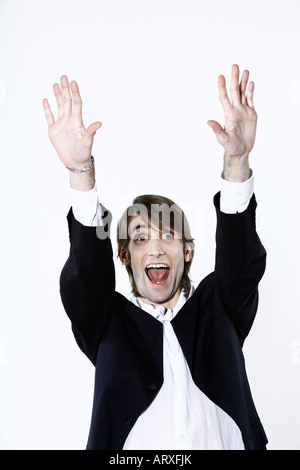 Studioportrait Schuss eines lustigen glücklich expressive dünn und groß Jünglings auf isolierte Hintergrund Stockfoto
