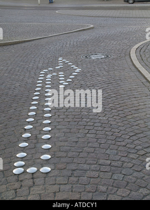 Richtungs-Pfeil auf einer Straße Stockfoto