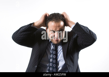 Wütend Geschäftsmann seine Haare Stockfoto