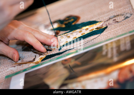 Dame arbeiten Wandteppich Stockfoto