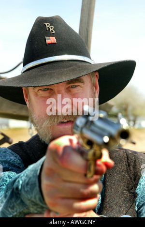 Ehrenamtliche Akteure kleiden als Cowboys zur Teilnahme an amerikanischen Old West Re-Enactments Stockfoto