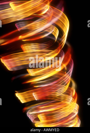 Spiralförmig Lichteffekt, rot- und Gelbtöne. Stockfoto