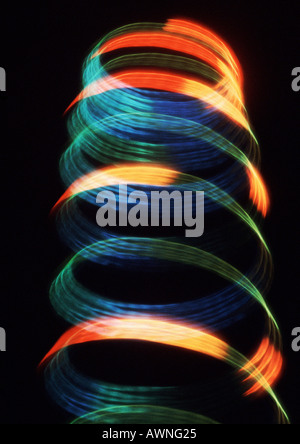 Spiraling light effect, reds, blues and yellows. Stockfoto