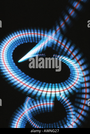 Spiraling light effect, blues, reds and white, black background Stockfoto