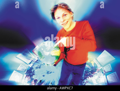 Junger Mann im Cyberspace auf Weltkugel, digital Composite. Stockfoto