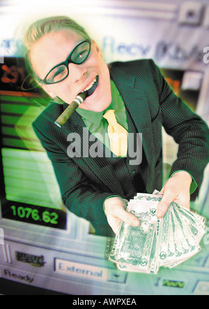 Geschäftsmann hält Haufen Geld, aus Computer-Monitor, digital Composite. Stockfoto