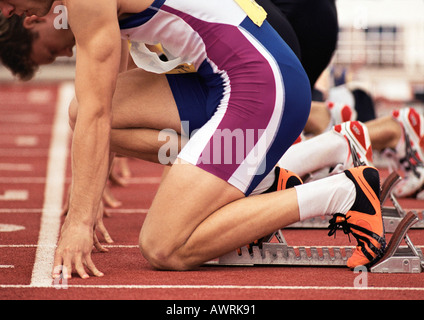 Männliche Läufer am Start-Block, close-up Stockfoto