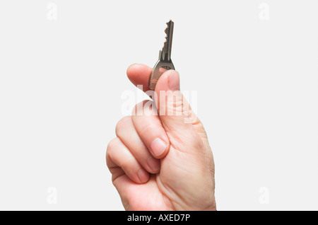 Personen-Hand-halten-Taste Stockfoto