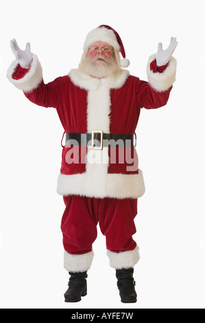 Santa Claus mit erhobenen Armen Stockfoto