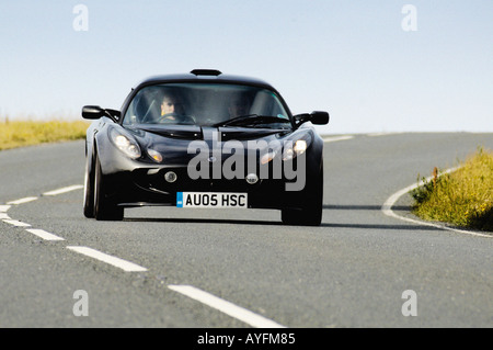 Black Lotus Exige 240r Auto fährt auf offener Straße. UK Stockfoto