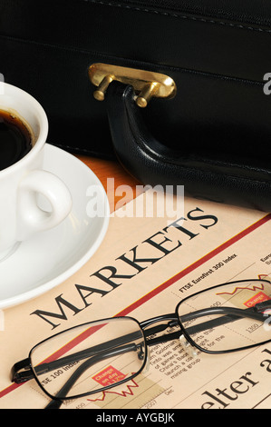 Finance and Investment Image Showing a Financial Paper Spectacles Cup of Coffee and a Briefcase on a Desk Stockfoto
