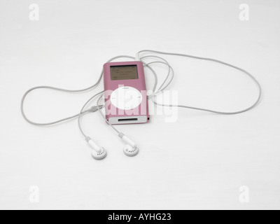 Pink Apple Ipod Mini und Kopfhörer Stockfoto