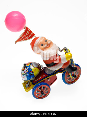 Santa Claus Metall Aufwickeln Spielzeug auf weißem Hintergrund Stockfoto