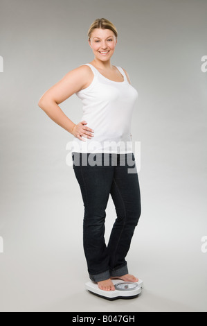 Eine Frau mit einem Gewicht von selbst Stockfoto