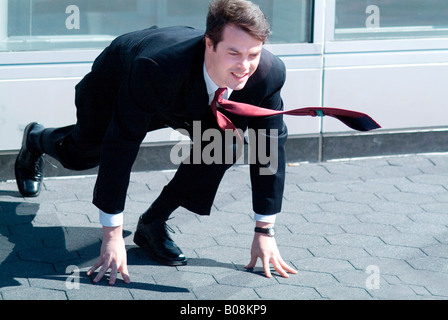 Geschäftsmann in sprinten Lage Stockfoto