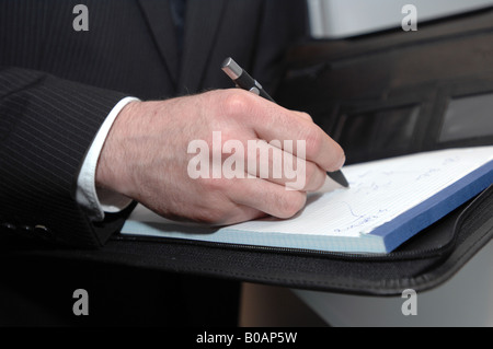 Geschäftsmann Notizen Stockfoto