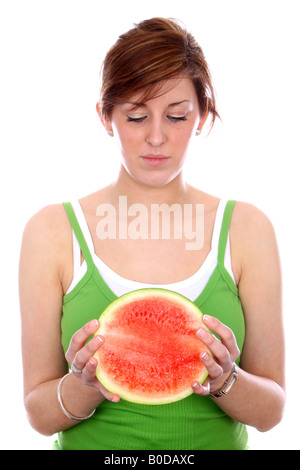 Teenager-Mädchen hält Wassermelone Modell veröffentlicht Stockfoto