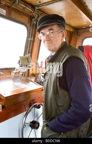 Billy Shein als Kapitän eines seiner Flotte von frohe tour Boote aus gemeinsame Farne Islands, Northumberland, England, UK Stockfoto