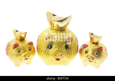 Chinesische goldene Sparschweine mit Goldbarren Stockfoto