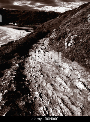 Pwll du Bay ist eine kleine einsame Küsten Bucht in der Nähe von Pennard. Dieses Sepia getönte Foto stammt von dem alten Weg Weg Stockfoto