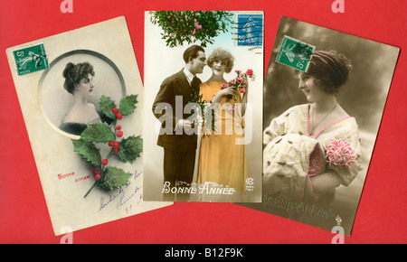 Traditionelle französische "Bonne Annee" Grüße Postkarten Darstellung glückliche Paar oder single-Frauen, ca. 1905-10. Stockfoto