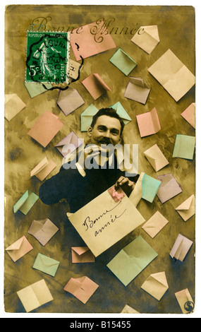 Traditionelle französische "Bonne Année" (Happy New Year) Gruß Ansichtskarte Mann empfangen Briefe - 1903. Stockfoto