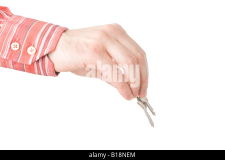 Hände halten / geben Hausschlüssel isoliert auf weiß Stockfoto