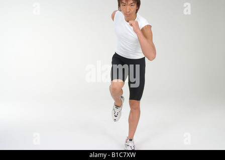 Junger Mann läuft Stockfoto
