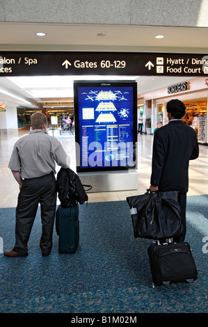 Richtungen der Passagier an Bord der internationale Flughafen Orlando Florida Stockfoto