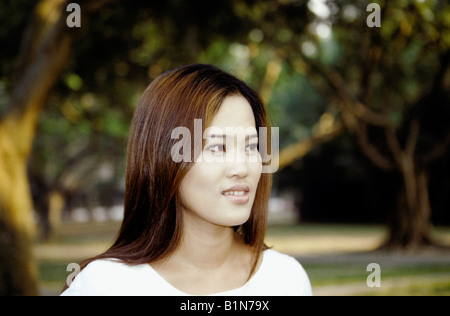 Asian Chinese Woman Outside In Park Portrait Stockfoto