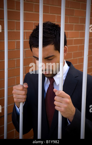 Geschäftsmann im Gefängnis Stockfoto