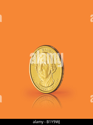Ein USA-Dollar-Münze auf eine orange Oberfläche. Stockfoto